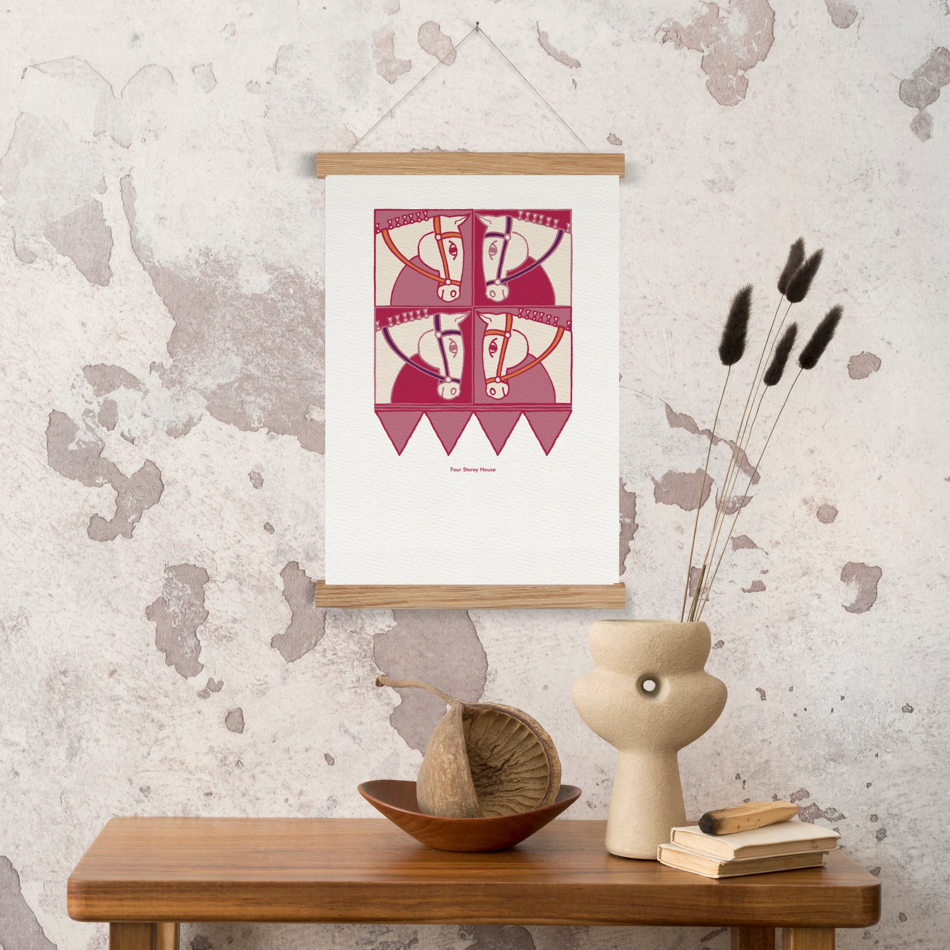 Original A2 Art Print - Horse featuring a unique abstract horse design in shades of pink and red, displayed on a wall with minimalist wooden hanger and modern decorative accents.